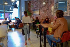 Customers pictured in the Scullery Café, Waterloo Street last summer. Children under 12 are not counted in the six per table maximum. DER2027GS – 001