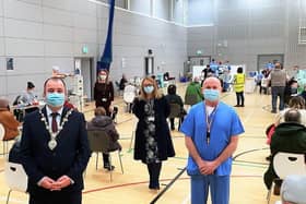 Mayor Tierney with health staff at Foyle Arena.