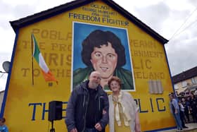 Mrs Bridie McBrearty pictured with Bogside Artist Kevin Hasson at the George McBrearty mural in Rathkeele Way at a previous commemoration. DER2217GS002