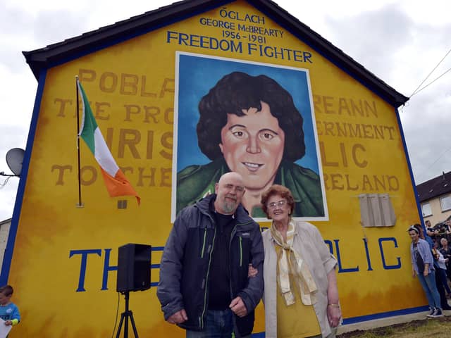 Mrs Bridie McBrearty pictured with Bogside Artist Kevin Hasson at the George McBrearty mural in Rathkeele Way at a previous commemoration. DER2217GS002