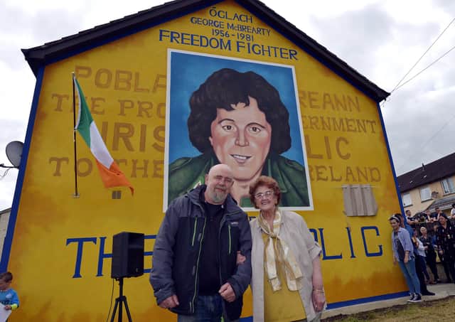 Mrs Bridie McBrearty pictured with Bogside Artist Kevin Hasson at the George McBrearty mural in Rathkeele Way at a previous commemoration. DER2217GS002