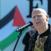 Veteran civil rights campaigner Eamonn McCann addresses the Palestinian solidarity Rally at Free Derry Wall on Saturday after last. Photo: George Sweeney. DER2120GS – 075