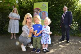 Health Minister Robin Swann with the Chief Executive of the Northern Ireland Childminder Association (NICMA), Patricia Lewsley-Mooney and childminder Joan Boyd with Henry and Margo