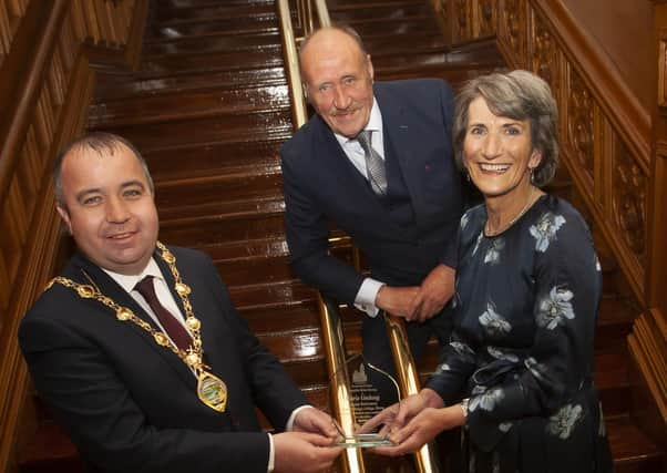 MARIE HONOURED. . . . .The Mayor of Derry City and Strabane District Council, Brian Tierney making a presentation to Marie Lindsay, former Principal, St. Mary's College, Derry, on the occasion of her retirement and recognition of  her contribution and commitment to education. Included is Marie's husband Collie. (Photos: Jim McCafferty Photography)