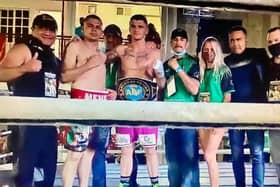 Connor Coyle pictured in the ring with his opponent Edgar Ortega, his coaching team and girlfriend Eva Vipartaite after winning the ABF Intercontinental Americas middleweight belt at the weekend.