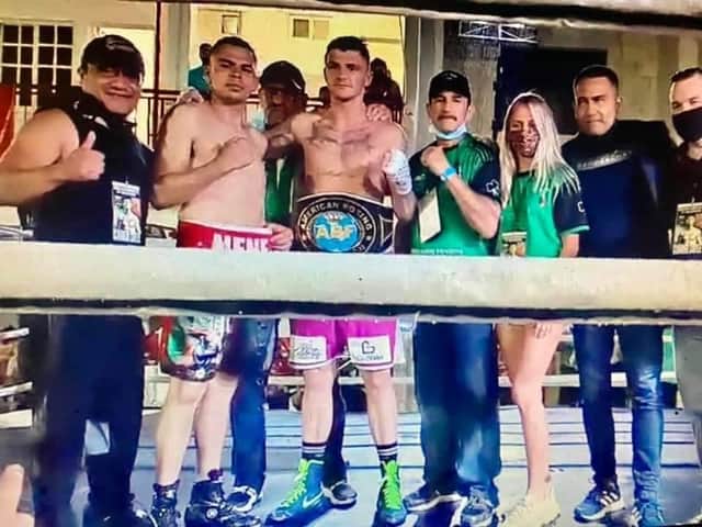 Connor Coyle pictured in the ring with his opponent Edgar Ortega, his coaching team and girlfriend Eva Vipartaite after winning the ABF Intercontinental Americas middleweight belt at the weekend.