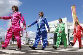 CODA Managing Director Steve Frazer and staff as The Fab Four in Sergeant Pepper costumes meets Abbey Road.