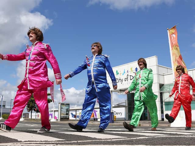 CODA Managing Director Steve Frazer and staff as The Fab Four in Sergeant Pepper costumes meets Abbey Road.