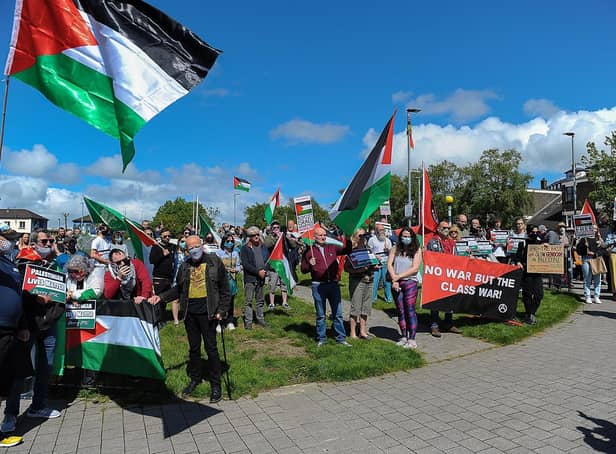 Some of the attendance at the Palestinian solidarity Rally at Free Derry Wall on Saturday after last. Photo: George Sweeney. DER2120GS – 070