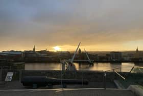 Derry city centre skyline at sunset.