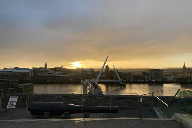 Derry city centre skyline at sunset.