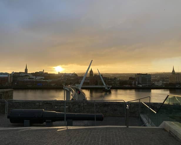 Derry city centre skyline at sunset.