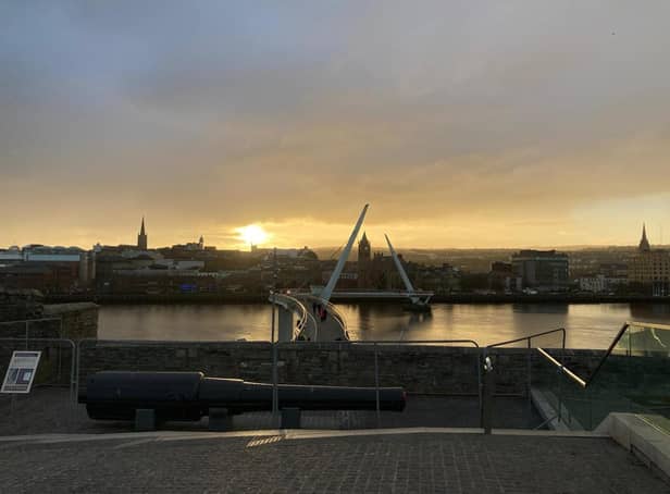 Derry city centre skyline at sunset.