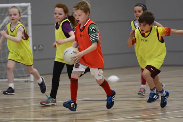 Youngsters pictured several years back during the Urban Gaelic Games Programme P4 Gaelic Football Blitz in the Foyle Arena. DER2315-129KM