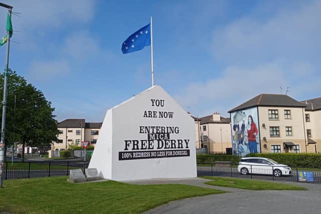 Iconic Free Derry Corner has been given a special make-over in solidarity with the families affected by MICA defective blocks across the border in neighbouring Donegal.