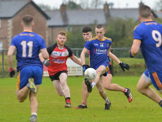 Steelstown Cahir McMonagle in action against Greenlough in last season's Intermediate Final. The Brian Ogs face a tough start away to Banagher, as do Greenlough who travel to Kilrea. (Photo: George Sweeney)