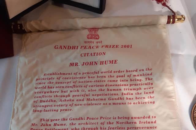 John Hume's Gandhi Peace Prize citation on display in the Guildhall.
