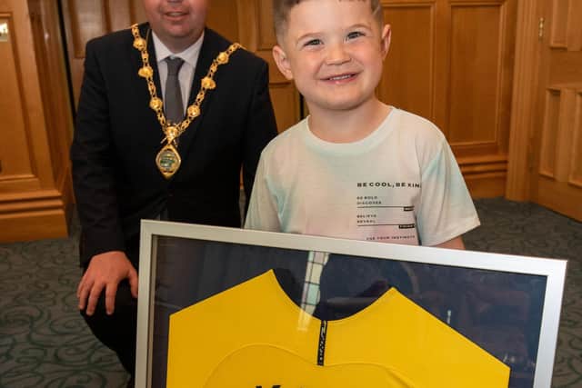 Caleb Toland who under went brain surgery earlier this year was the centre of, Derry City and Strabane District Council, Mayor Brian Tierneyâ€TMs attention during a reception in the Guidhall. Caleb received signed shirts from, Harry Kane, James McClean, Robbie Keane and Patrick McEleney. Picture Martin McKeown. 02.06.21