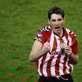 Ruaidhri Higgins celebrates winning the FAI Cup with Derry City at the Aviva Stadium in 2012.