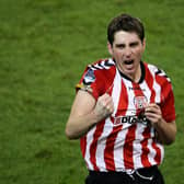 Ruaidhri Higgins celebrates winning the FAI Cup with Derry City at the Aviva Stadium in 2012.