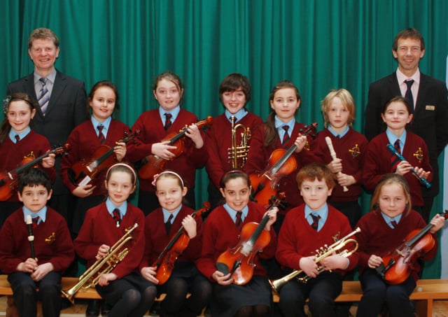 St. Eithnes PS pupils who have recently achieved music awards from Trinity College of Music, London. The students are pictured here with school priocipal Mr Cosgrove and music teacher Mr Gormley. (0312JB04)