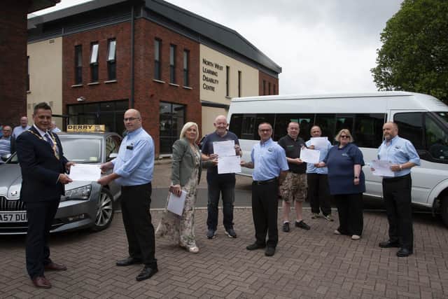 DISABILITY AWARENESS CERTIFICATES. . . . .The new Mayor of Derry City and Strabane District Council, Graeme Warke pictured presenting Destined-Derry Taxis Certificates of Achievement for Completing Learning Disability and Autism Awareness Training for Taxi Dispatchers and Drivers awards at the North West Learning Disability Centre on Tuesday morning. Accepting his award is Gerry Breslin, manager, Derry Taxis. Included from left are Caroline Oâ€TMHara, Facilitator, Thomas Starrs, Jim Kelly, Phil Thompson, Liam Duffy, Adere Darby, chair, Destined and Brian Lyttle. The interactive training course was designed to help managers and employers understand their responsibilities towards people with learning disabilities and autism.  (Photos: Jim McCafferty Photography)