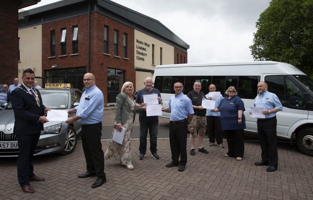 DISABILITY AWARENESS CERTIFICATES. . . . .The new Mayor of Derry City and Strabane District Council, Graeme Warke pictured presenting Destined-Derry Taxis Certificates of Achievement for Completing Learning Disability and Autism Awareness Training for Taxi Dispatchers and Drivers awards at the North West Learning Disability Centre on Tuesday morning. Accepting his award is Gerry Breslin, manager, Derry Taxis. Included from left are Caroline Oâ€TMHara, Facilitator, Thomas Starrs, Jim Kelly, Phil Thompson, Liam Duffy, Adere Darby, chair, Destined and Brian Lyttle. The interactive training course was designed to help managers and employers understand their responsibilities towards people with learning disabilities and autism. (Photos: Jim McCafferty Photography)