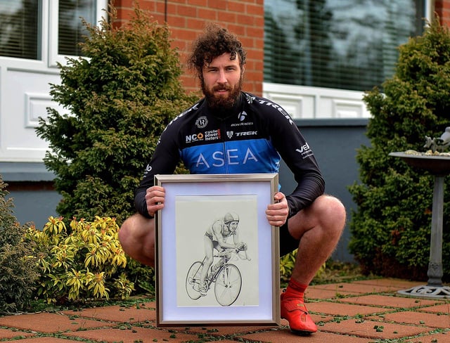 Danny Quigley, who will complete 10 ironman triathlons in 10 days, in memory of his late father, raising funds for suicide awareness pictured with a sketch of his dad. Photo: George Sweeney. DER2112GS - 003