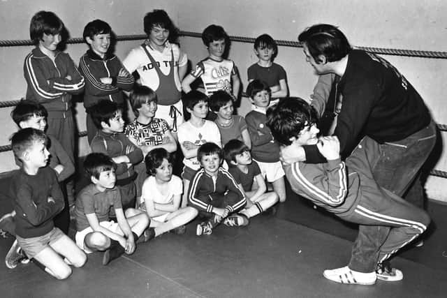 1980s... Mickey Gallagher teaching youngsters to wrestle at Marian Hall.