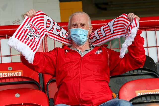 Derry City fan Vincent Dunnion showing his support in the Southend Park stand.