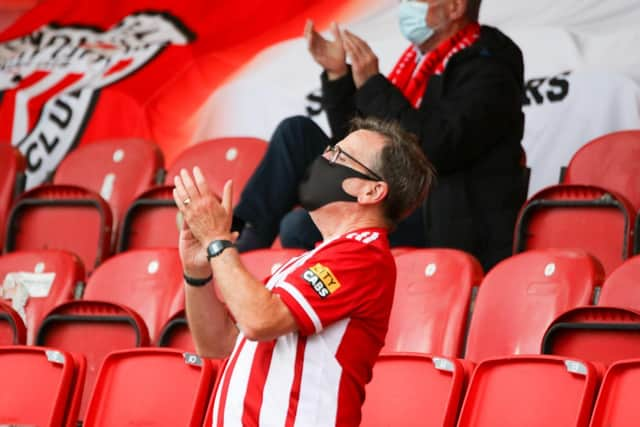 Derry City fan Dick Tucker makes his presence felt on the night.