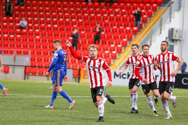Marc Walsh runs towards the Derry fans to celebrate his equalising goal.