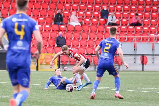 Ronan Boyce appears to be brought down inside the penalty area by Anto Breslin.