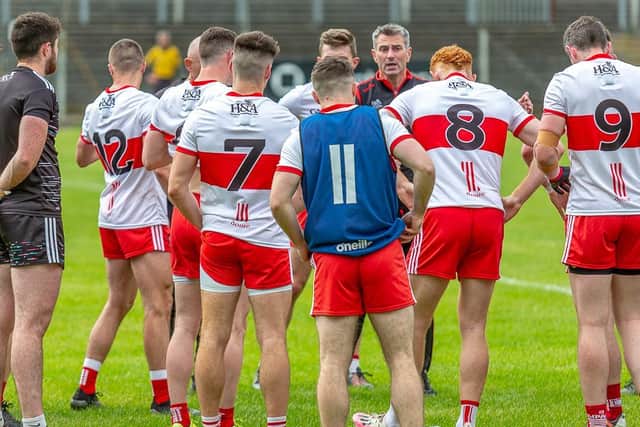 Rory Gallagher talks to his players during the second half water break against Limerick in Carrick-on-Shannon on Saturday. (Photo: Stefan Hoare)