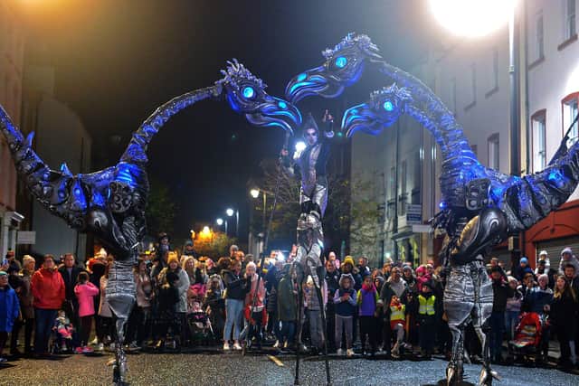 The giant Sarusus entertain the crowds at the Awakening on the Walls carnival in the city centre. DER4419GS - 016
