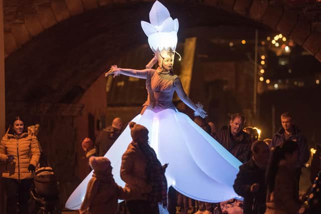 A dancer emerges fron the City Walls during the Awakening of the Walls as part of a previous halloween festival in ther city. Picture Martin McKeown. 28.10.19