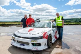 Young Donemana driver Ben Rogers (16) pictured beside his drift racing car this week with his father Gordon and Jim McKeebver, development co-ordinator, Cruise Centre, Eglinton, Derry. (Photo: Damien Stewart)