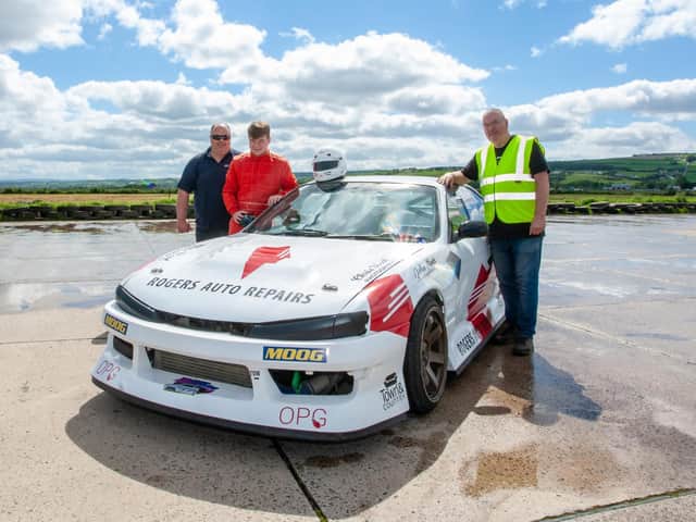 Young Donemana driver Ben Rogers (16) pictured beside his drift racing car this week with his father Gordon and Jim McKeebver, development co-ordinator, Cruise Centre, Eglinton, Derry. (Photo: Damien Stewart)
