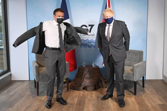 Prime Minister Boris Johnson (right) and French President Emmanuel Macron, ahead of a bilateral meeting during the G7 summit in Cornwall. Picture date: Saturday June 12, 2021. PA Photo. See PA story POLITICS G7. Photo credit should read: Stefan Rousseau/PA Wire