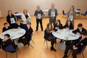 Pupils from St Joseph's Boys School and Lisneal College, who took part in the Children’s Safety Education Programme, funded by the Housing Executive, and held in Lisneal College. Front from left, Callum Keenan, Shay Smith, Darragh O'Donnell, Ryan White and Aidan McFeely-Doherty, Emily Hamilton, Anna Loughery, Chloe O'Kane, Jacob Bond and Hari Gillespie. Standing, from left, are Fiona Harrigan, Learning Support Manager Lisneal College, Jackie O'Kane, Housing Executive, Eddie Breslin, Housing Executive, Michael Fitzgerald, Children's Safety Education Foundation, and Aisling O'Kane, Learning for Life and Work Co-Ordinator St Joseph’s Boys School.