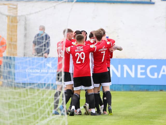 Derry City players celebrate Will Patching's stunning free-kick at the end of the first half. Photographs by Kevin Moore.