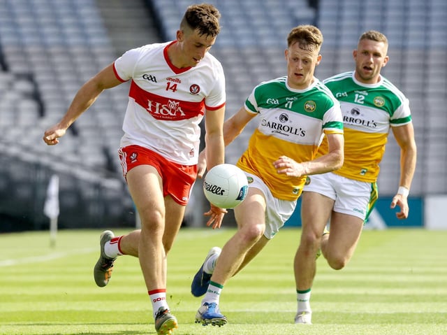 Shane McGuigan goes past Peter Cunningham during Saturday's final at Croke Park. (Photo: INPHO/Lorraine O’Sullivan)