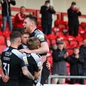Derry City players celebrate after Ronan Boyce's late equaliser at Brandywell. Photo by Kevin Moore.