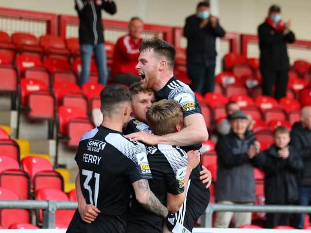 Derry City players celebrate after Ronan Boyce's late equaliser at Brandywell. Photo by Kevin Moore.