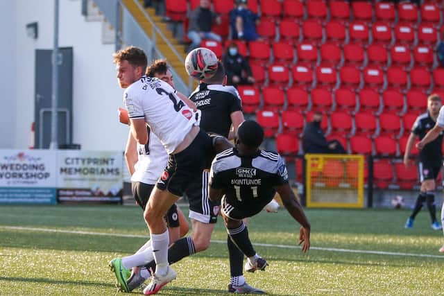 James Akintunde attempts a scissor kick under pressure from Sligo right back Lewis Banks in the first half. Photographs by Kevin Moore.