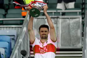 Derry captain Chrissy McKaigue lifts the Division Three trophy in Croke Park on Saturday after defeating Offaly. (Photo: Inpho\Lorraine O'Sullivan)