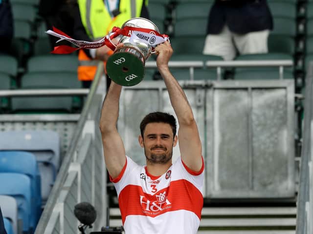 Derry captain Chrissy McKaigue lifts the Division Three trophy in Croke Park on Saturday after defeating Offaly. (Photo: Inpho\Lorraine O'Sullivan)