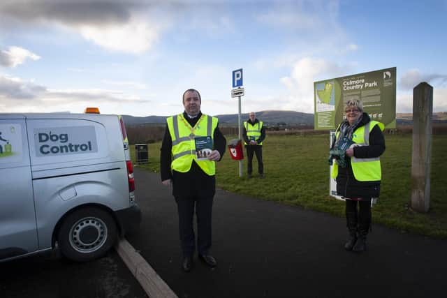 Councillor Brian Tierney pictured with Kieran Graham, DCSDC Dog Warden, and Councillor Angela Dobbins at Culmore Country Park recently to promote responsible dog ownership. (Photo: Jim McCafferty Photography)