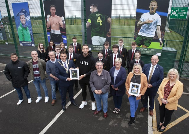 LOCAL SPORTING HEROES. . . . The Mayor of Derry City and Strabane District Council, Alderman Graham Warke pictured presenting Bright and Republic of Ireland international footballer Shane Duffy with a miniature copy of his portrait during Wednesdayâ€TMs Portrait Launch †̃Local Sporting Heroesâ€TM at Leafair Well Being Village. Included are Eddie Breslin, Housing Executive, sponsors, Peter McDonald, chair, Leafair Community Association, councillors Angela Dobbins and Sandra Duffy, Karen Mullan, MLA, Gerry McMonagle and students from St. Brigidâ€TMs College, Carnhill. (Photos: Jim McCafferty Photography)