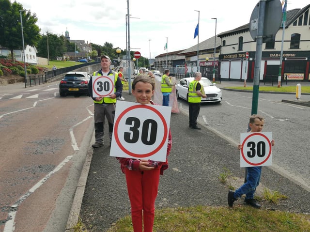 Residents and activisits protest on Friday.